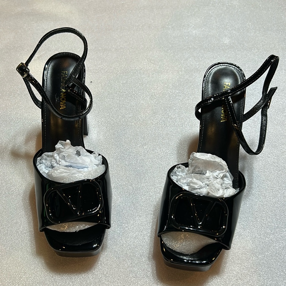 Platform patent heels. Size 11. New in box.